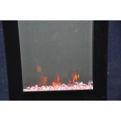 1069 - A FOCALPOINT EF11-16 MODERN GLASS FIRE EFFECT HEATER with 'crystal coals', colour change lighting, c... 