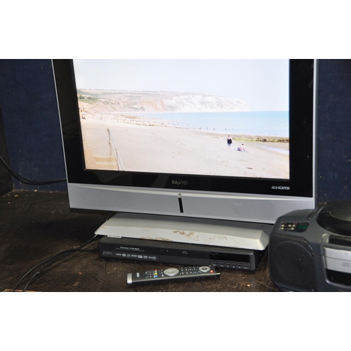 1084 - A SANYO CES26WSD7 26in TV with remote, a Sanyo DVD player (no remote), a Matsui portable Hi Fi and a... 