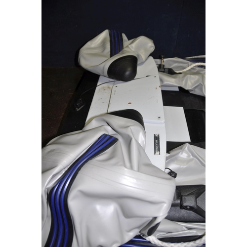 1096 - A PLASTIMO P-220 INFLATABLE DINGHY in carry bag with pump, wooden plank seat and hard tailboard