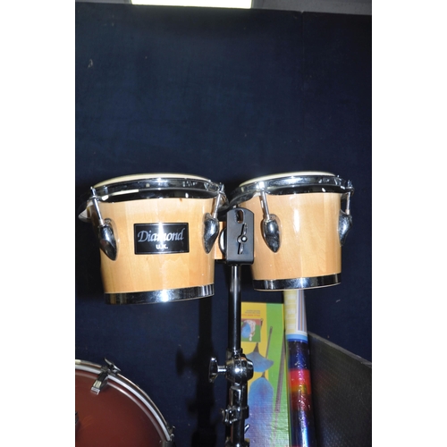 1110 - A COLLECTION OF PERCUSSION INSTRUMENTS including a pair of congos with stand, a pair of Diamond UK b... 