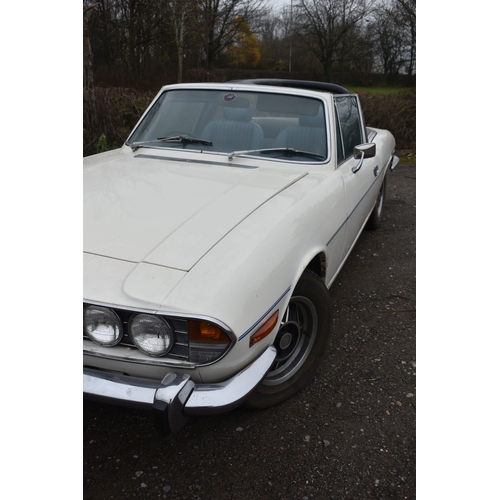 1000 - A 1974 TRIUMPH STAG CONVERTIBLE, REGISTRATION NUMBER JOJ 949N, finished in white with blue trim, tri... 