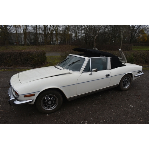 1000 - A 1974 TRIUMPH STAG CONVERTIBLE, REGISTRATION NUMBER JOJ 949N, finished in white with blue trim, tri... 