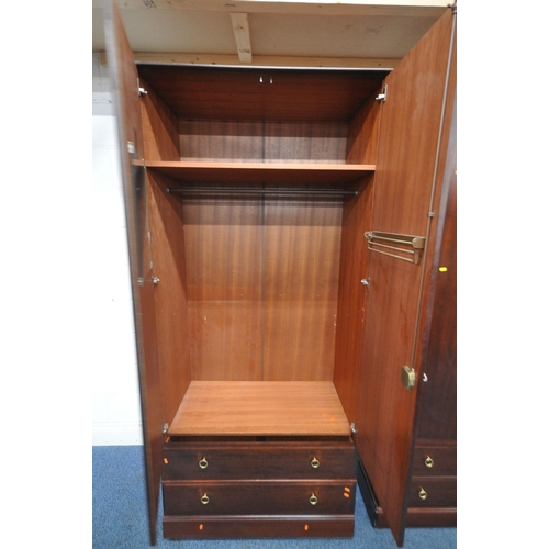 1201 - A PAIR OF TALL STAG MINSTREL DOUBLE DOOR WARDROBES, each with two drawers, width 104cm x depth 61cm ... 