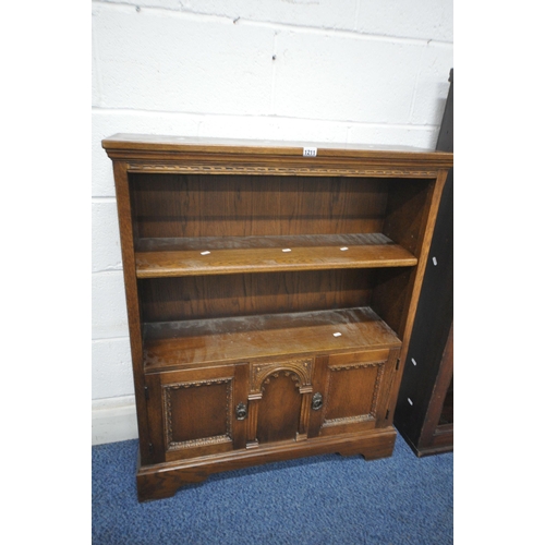 1211 - A 20TH CENTURY OAK BOOKCASE, with a single adjustable shelf, above two doors, width 84cm x depth 26c... 