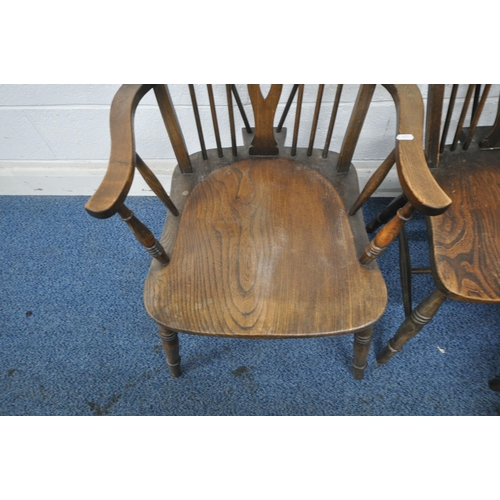 1212 - A SET OF SIX ELM SEATED WHEEL BACK CHAIRS, including one carver, along with another chair (condition... 