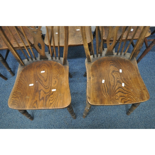 1212 - A SET OF SIX ELM SEATED WHEEL BACK CHAIRS, including one carver, along with another chair (condition... 