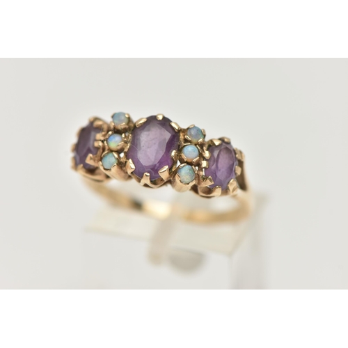 15 - A 9CT GOLD AMETHYST AND OPAL RING, set with three oval cut amethysts each claw set, interspaced with... 