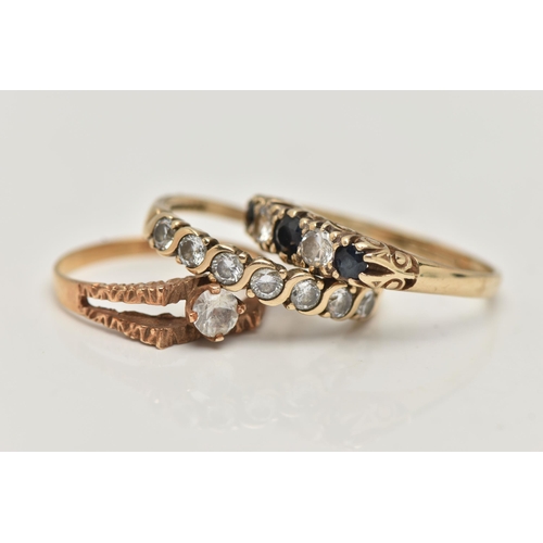 18 - THREE GEM SET RINGS, the first a 9ct gold colourless topaz single stone ring, textured bifurcated sh... 