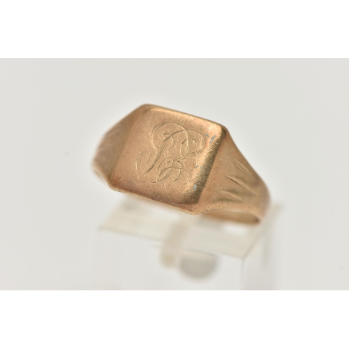 23 - A YELLOW METAL GENTS SIGNET RING, square polished signet, engraved monogram, textured tapering shoul... 