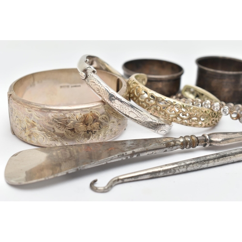 39 - SILVER BANGLES, NAPKIN RINGS AND OTHER ITEMS, to include a silver wide hinged floral bangle, push bu... 