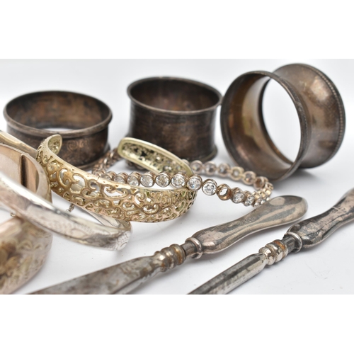 39 - SILVER BANGLES, NAPKIN RINGS AND OTHER ITEMS, to include a silver wide hinged floral bangle, push bu... 