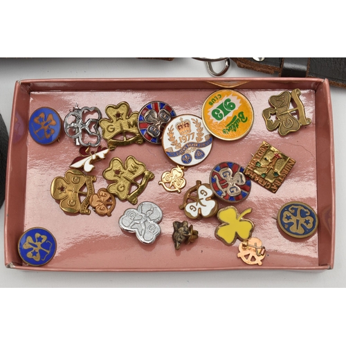 59 - A SELECTION OF MAINLY METAL GIRL GUIDE BADGES AND LEATHER GIRL GUIDE BELTS ETC., badges include Butl... 