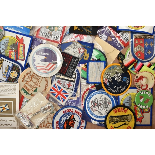 83 - A BOX OF MAINLY BADGES, to include many patch badges, mainly souvenir place badges, including Mexico... 