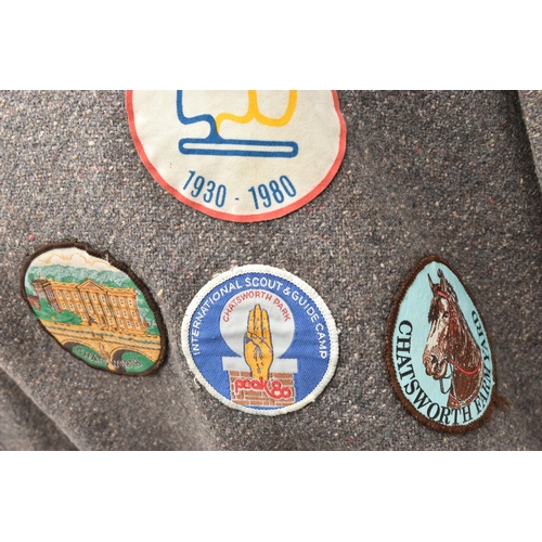 84 - THREE BLANKET PONCHOS WITH MAINLY GIRL GUIDE AND SCOUT BADGES, including two Kandersteg Internationa... 