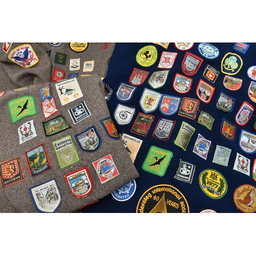 84 - THREE BLANKET PONCHOS WITH MAINLY GIRL GUIDE AND SCOUT BADGES, including two Kandersteg Internationa... 