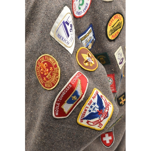 84 - THREE BLANKET PONCHOS WITH MAINLY GIRL GUIDE AND SCOUT BADGES, including two Kandersteg Internationa... 