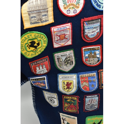 84 - THREE BLANKET PONCHOS WITH MAINLY GIRL GUIDE AND SCOUT BADGES, including two Kandersteg Internationa... 