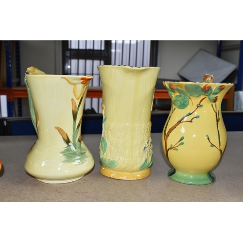 399 - SIX 1930'S BURLEIGH WARE ART DECO JUGS, comprising an exotic humming bird handle 7015, (hairline cra... 