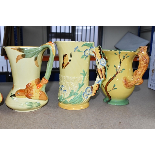 399 - SIX 1930'S BURLEIGH WARE ART DECO JUGS, comprising an exotic humming bird handle 7015, (hairline cra... 