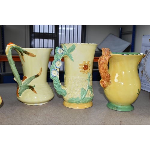 399 - SIX 1930'S BURLEIGH WARE ART DECO JUGS, comprising an exotic humming bird handle 7015, (hairline cra... 