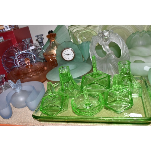 463 - A GROUP OF DECORATIVE GLASS WARE, to include uranium glass dressing table items, including a figural... 