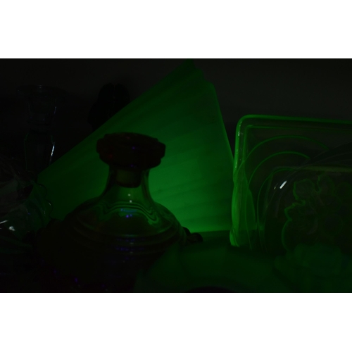 463 - A GROUP OF DECORATIVE GLASS WARE, to include uranium glass dressing table items, including a figural... 