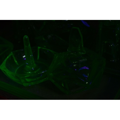 463 - A GROUP OF DECORATIVE GLASS WARE, to include uranium glass dressing table items, including a figural... 