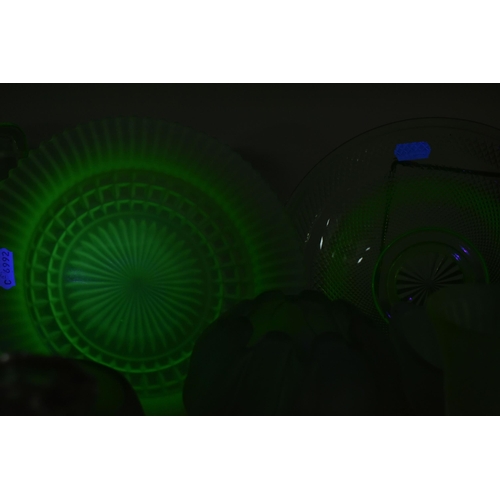 463 - A GROUP OF DECORATIVE GLASS WARE, to include uranium glass dressing table items, including a figural... 