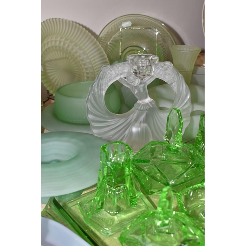 463 - A GROUP OF DECORATIVE GLASS WARE, to include uranium glass dressing table items, including a figural... 