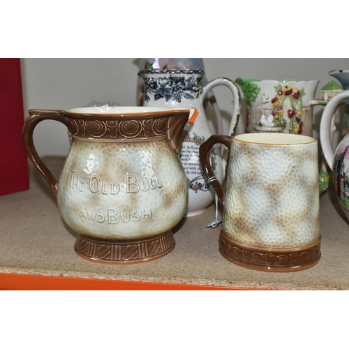 469 - A GROUP OF JUGS AND A TANKARD, comprising a Falcon Ware 'Cavalier' tankard (crazing and possible hai... 