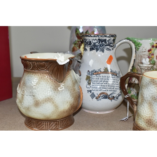469 - A GROUP OF JUGS AND A TANKARD, comprising a Falcon Ware 'Cavalier' tankard (crazing and possible hai... 
