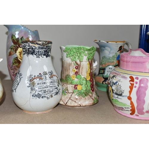 469 - A GROUP OF JUGS AND A TANKARD, comprising a Falcon Ware 'Cavalier' tankard (crazing and possible hai... 