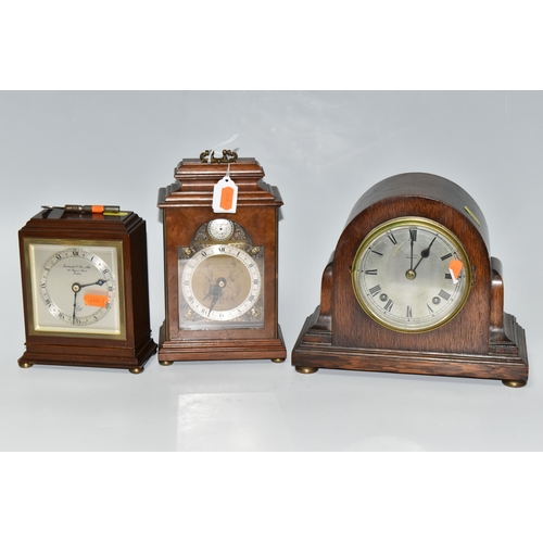 496 - THREE WOODEN CASED MANTEL CLOCKS, comprising an Art Deco style Elliot clock retailed by Garrard & Co... 