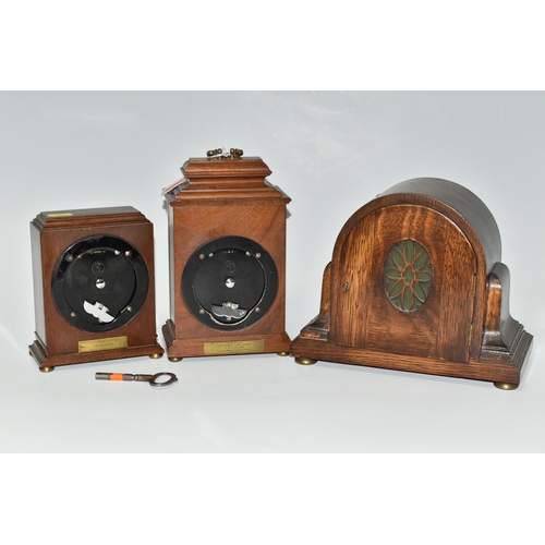 496 - THREE WOODEN CASED MANTEL CLOCKS, comprising an Art Deco style Elliot clock retailed by Garrard & Co... 