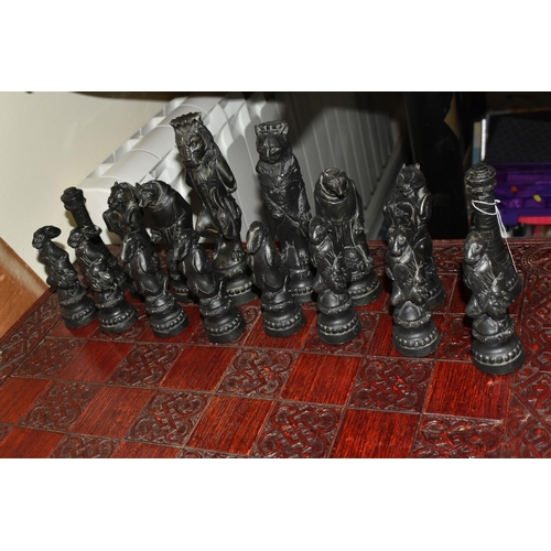 505 - A REYNARD THE FOX CHESS SET, resin figures in a cream and black colourway, approximate height of the... 