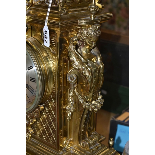 537 - A LATE 19TH CENTURY FRENCH BRASS MANTEL CLOCK, with a dome top with a coronet finial, surrounded by ... 