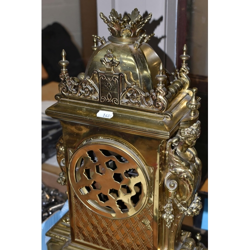 537 - A LATE 19TH CENTURY FRENCH BRASS MANTEL CLOCK, with a dome top with a coronet finial, surrounded by ... 