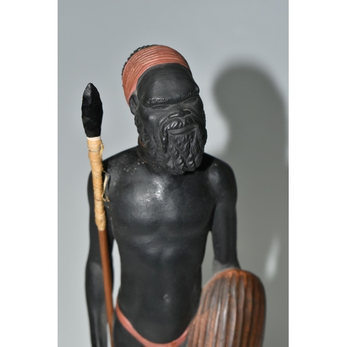 545 - AN AUSTRALIAN MID-CENTURY PIETER VAN DER HELDER ABORIGINAL FIGURE,  a slip cast ceramic figure of a ... 