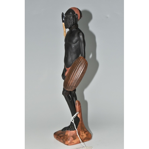 545 - AN AUSTRALIAN MID-CENTURY PIETER VAN DER HELDER ABORIGINAL FIGURE,  a slip cast ceramic figure of a ... 