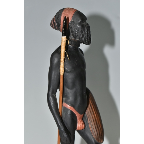 545 - AN AUSTRALIAN MID-CENTURY PIETER VAN DER HELDER ABORIGINAL FIGURE,  a slip cast ceramic figure of a ... 