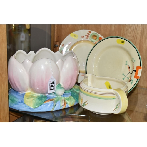 547 - FOUR PIECES OF CLARICE CLIFF CERAMICS, comprising a Newport Pottery pale pink Water Lily jardiniere ... 