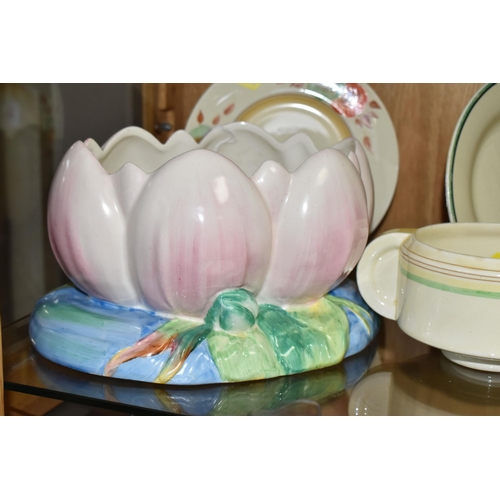 547 - FOUR PIECES OF CLARICE CLIFF CERAMICS, comprising a Newport Pottery pale pink Water Lily jardiniere ... 