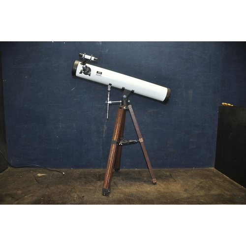 1109 - AN ASTRO ASTRONOMICAL REFLECTOR TELESCOPE, marked D90mm F640mm, with front cap and a wooden tripod s... 