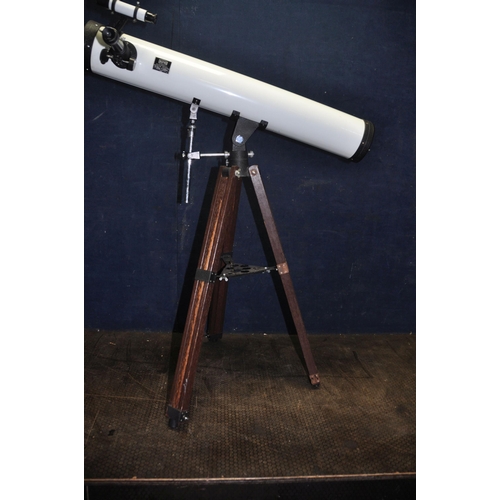 1109 - AN ASTRO ASTRONOMICAL REFLECTOR TELESCOPE, marked D90mm F640mm, with front cap and a wooden tripod s... 