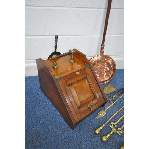 1323 - AN EARLY 20TH CENTURY OAK PURDONIUM, with a hinged door and later shovel, a copper bed pan and a com... 