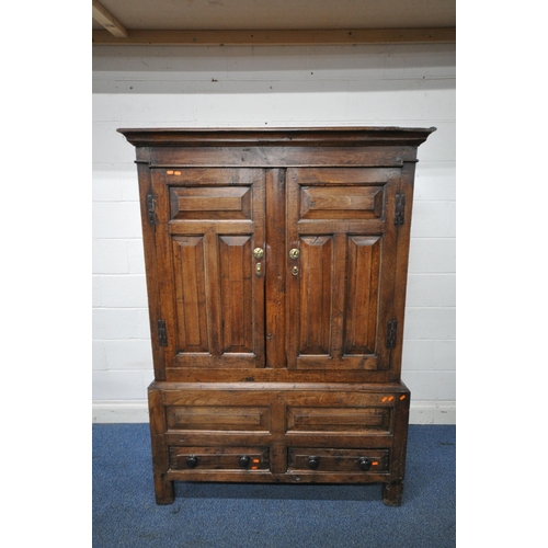 1324 - A 17TH CENTURY AND LATER OAK TWO DOOR CUPBOARD, the double fielded panel doors enclosing an open int... 