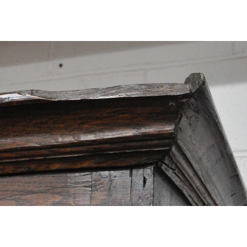 1324 - A 17TH CENTURY AND LATER OAK TWO DOOR CUPBOARD, the double fielded panel doors enclosing an open int... 