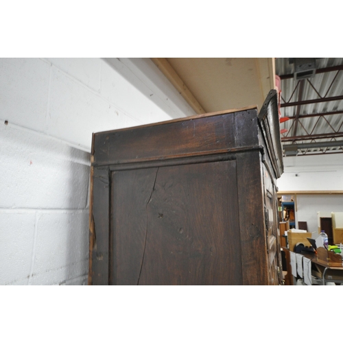 1324 - A 17TH CENTURY AND LATER OAK TWO DOOR CUPBOARD, the double fielded panel doors enclosing an open int... 