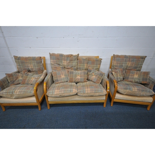 1329 - A THREE PIECE LOUNGE SUITE, with beech frames, comprising a two seater sofa and a pair of armchairs ... 