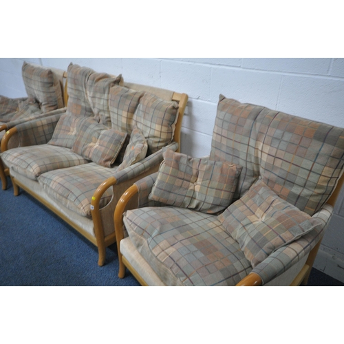 1329 - A THREE PIECE LOUNGE SUITE, with beech frames, comprising a two seater sofa and a pair of armchairs ... 